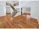 Bright open-concept living space features wood floors, staircase, and an abundance of natural light at 2180 Trailblazer Way, Castle Rock, CO 80109