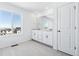 Clean bathroom with double vanity and view at 9324 Quartz St, Arvada, CO 80007