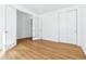 This bedroom boasts lots of natural light, clean white walls, and wood floors at 9324 Quartz St, Arvada, CO 80007