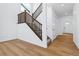 Bright entryway with hardwood floors, staircase, and access to other rooms at 9324 Quartz St, Arvada, CO 80007