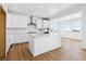 Bright kitchen with white cabinets, quartz countertops, and stainless steel appliances at 9324 Quartz St, Arvada, CO 80007