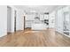 Open kitchen featuring a center island, white cabinets, and stainless steel appliances at 9324 Quartz St, Arvada, CO 80007