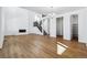 Spacious living room featuring hardwood floors, a fireplace, staircase, and modern design at 9324 Quartz St, Arvada, CO 80007