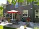 A picturesque backyard with a patio dining set, beautiful plants, and a well-maintained lawn for outdoor enjoyment at 16341 Maple Rock Ct, Parker, CO 80134