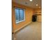 Unfinished basement area with a small window, providing natural light and storage space at 16341 Maple Rock Ct, Parker, CO 80134