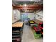 Unfinished basement with concrete floor, exposed ceiling and large window. Ideal for workshop or storage at 16341 Maple Rock Ct, Parker, CO 80134