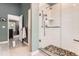 Beautiful bathroom boasting a glass enclosed shower with stunning tile work and modern fixtures at 16341 Maple Rock Ct, Parker, CO 80134