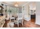 Cozy dining area featuring hardwood floors, a window seat, and soft, natural lighting at 16341 Maple Rock Ct, Parker, CO 80134