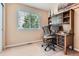 Inviting home office featuring a built-in desk and shelving, perfect for remote work at 16341 Maple Rock Ct, Parker, CO 80134