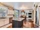 Well-lit kitchen with white cabinetry, granite countertops, stainless steel appliances, and a central island at 16341 Maple Rock Ct, Parker, CO 80134