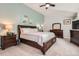 Relaxing main bedroom with a vaulted ceiling, soft lighting, and coordinated furniture at 16341 Maple Rock Ct, Parker, CO 80134