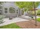 A private patio with stamped concrete, a fire pit, and an outdoor dining set for cozy outdoor living at 16341 Maple Rock Ct, Parker, CO 80134