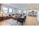 Spacious living room with abundant natural light, modern furnishings, and an open layout connecting to the kitchen at 4108 Estrella St, Brighton, CO 80601