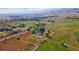 Vast property view features a beautiful home, surrounding greenery, and a defined boundary line at 5101 Saint Vrain Rd, Longmont, CO 80503