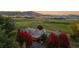 Expansive aerial view of a luxury home surrounded by open fields and mountain vistas at 5101 Saint Vrain Rd, Longmont, CO 80503