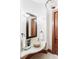 Stylish powder room featuring a stone sink and decorative mirror at 5101 Saint Vrain Rd, Longmont, CO 80503