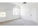 Bright bedroom with carpet, white walls and trim, and a large window for a peaceful outdoor view at 5101 Saint Vrain Rd, Longmont, CO 80503