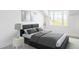 This bedroom has neutral decor, a comfortable bed, side tables and great natural light at 5101 Saint Vrain Rd, Longmont, CO 80503