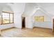 Spacious bonus room with hardwood floors, natural light, and wood trim at 5101 Saint Vrain Rd, Longmont, CO 80503