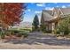 Circular driveway leading to a charming home with beautiful landscaping and mountain views at 5101 Saint Vrain Rd, Longmont, CO 80503