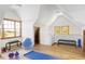 Bright exercise room with hardwood floors and workout equipment, offering a private fitness space at 5101 Saint Vrain Rd, Longmont, CO 80503