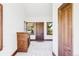 Entry foyer featuring a fireplace, dark wood trim, and two windows offering a view of the outdoors at 5101 Saint Vrain Rd, Longmont, CO 80503