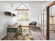 Bright home office with large windows, stylish furnishings, and a unique geometric rug at 5101 Saint Vrain Rd, Longmont, CO 80503