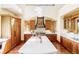 Spacious kitchen with wood cabinets, a large center island, and stainless steel appliances at 5101 Saint Vrain Rd, Longmont, CO 80503