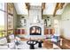 Cozy living room features a grand stone fireplace, vaulted ceilings, and ample seating at 5101 Saint Vrain Rd, Longmont, CO 80503
