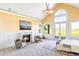 Primary bedroom featuring a fireplace, high ceiling, and French doors with outdoor views at 5101 Saint Vrain Rd, Longmont, CO 80503