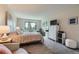This bedroom features a soft, cozy aesthetic with a queen-sized bed and a neutral color palette for a relaxing atmosphere at 14390 E Marina Dr # 403, Aurora, CO 80014