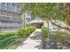 Inviting building entrance featuring manicured landscaping and a well-maintained walkway at 14390 E Marina Dr # 403, Aurora, CO 80014
