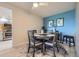 Charming dining area features modern lighting, stylish furniture, and bright wall art at 14390 E Marina Dr # 403, Aurora, CO 80014