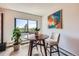 Cozy dining nook featuring lots of light and a view of a green outdoor scene at 14390 E Marina Dr # 403, Aurora, CO 80014