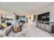 Open-concept living room with views into the kitchen and dining areas with modern decor at 14390 E Marina Dr # 403, Aurora, CO 80014