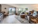 Bright living room featuring a balcony, modern furnishings, and lots of natural light at 14390 E Marina Dr # 403, Aurora, CO 80014