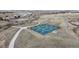 Aerial view of tennis and pickleball courts, walking paths, and open space in a community setting at 1825 Spaulding Cir, Superior, CO 80027