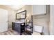 Bathroom with double sink vanity, large mirror, modern lighting, hardwood floors and shelving for storage at 1825 Spaulding Cir, Superior, CO 80027