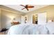 Bedroom with a ceiling fan, hardwood floors, and access to a closet and ensuite bath at 1825 Spaulding Cir, Superior, CO 80027