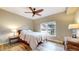 Comfortable bedroom showcasing a ceiling fan, large window and hardwood floors at 1825 Spaulding Cir, Superior, CO 80027
