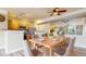 Inviting dining area featuring a wood table with seating and views of the kitchen and living room at 1825 Spaulding Cir, Superior, CO 80027