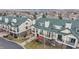 Inviting townhome featuring a private balcony, manicured lawn and a peek at mountain views in the background at 1825 Spaulding Cir, Superior, CO 80027