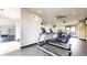Modern gym space featuring treadmills, ceiling fans, and mounted televisions at 1825 Spaulding Cir, Superior, CO 80027