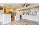 Bright open concept kitchen featuring stainless steel appliances, a breakfast bar, and wood flooring at 1825 Spaulding Cir, Superior, CO 80027