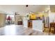 Open concept living area featuring wood floors, kitchen and living room views, and balcony access at 1825 Spaulding Cir, Superior, CO 80027
