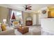 Inviting living room with wood floors and natural light from sliding glass doors leading to a private balcony at 1825 Spaulding Cir, Superior, CO 80027