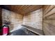 This is a bright and clean wooden sauna with built-in benches and a red electric heater at 1825 Spaulding Cir, Superior, CO 80027