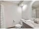 Clean and functional bathroom featuring a shower, toilet, and vanity with a gray cabinet at 8820 W 80Th Dr, Arvada, CO 80005