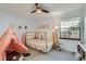 Bright bedroom featuring a themed decor, natural light and plush carpet at 8820 W 80Th Dr, Arvada, CO 80005