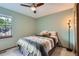 Cozy bedroom featuring neutral walls, natural light and a ceiling fan at 8820 W 80Th Dr, Arvada, CO 80005